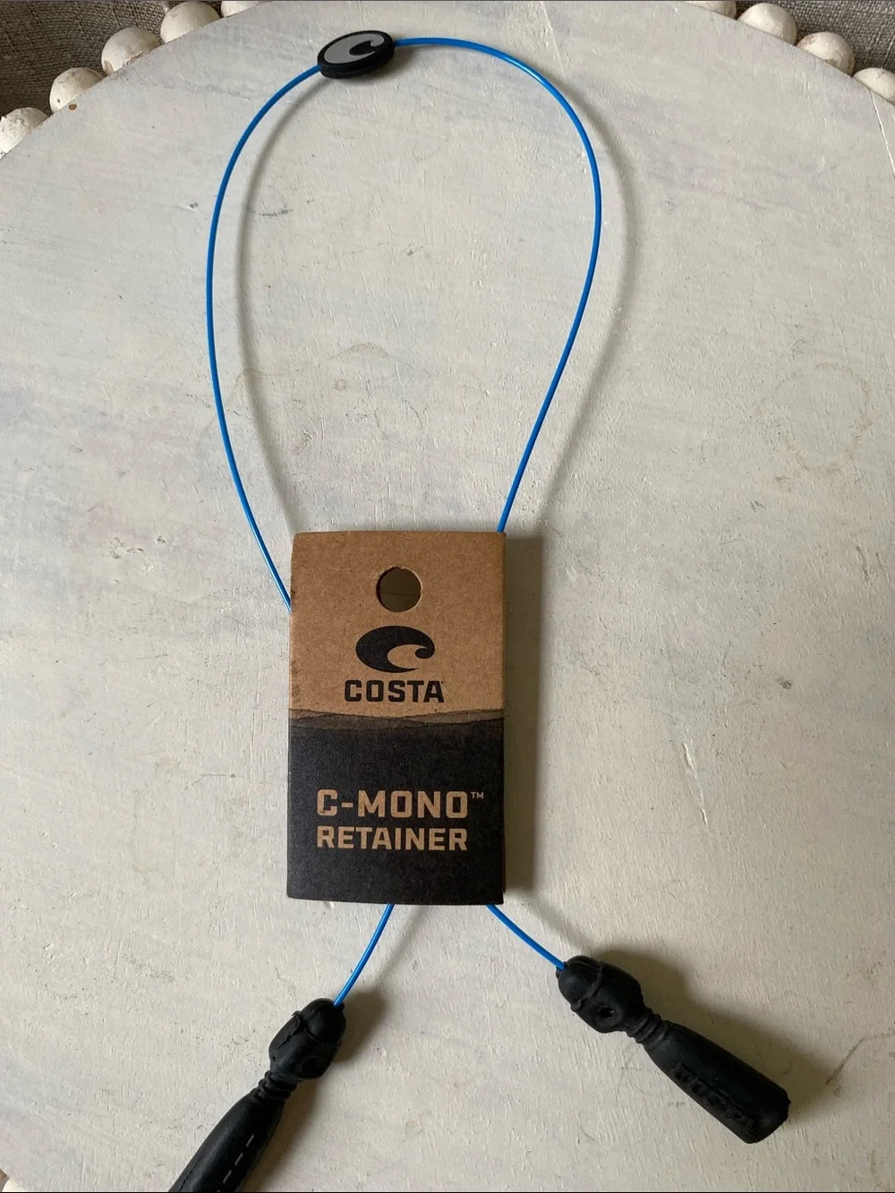Costa eyewear retainer in bright blue with black grips